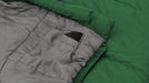 Outwell Campion Junior Sleeping Bag - Green feature image showing pocket with mobile phone in it