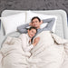 Bestway Queen Size Alwayzaire Airbed 80" x 60" x 18" lifestyle image of man and woman asleep on bed and bed on grey carpet
