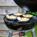 Cadac Tapas Dishes - Set of 4 - lifestyle image, showing tapas dishes being used to cook food on camping barbecue