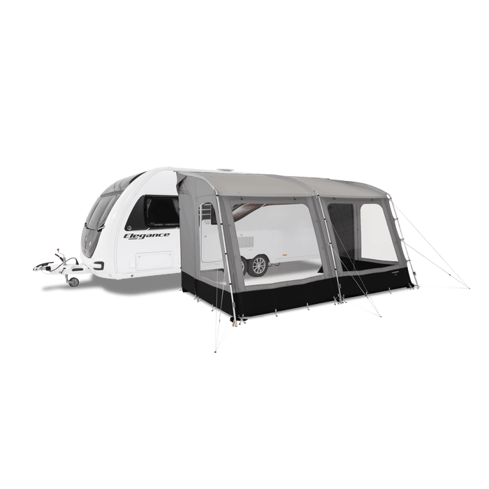 Dometic Rally Poled Caravan Porch Awning - product image, showing front-side view of awning attached to caravan and pitched with guylines, with all windows open