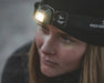 Easy Camp Clover Camping Head Torch - lifestyle image, showing close-up of person wearing head torch
