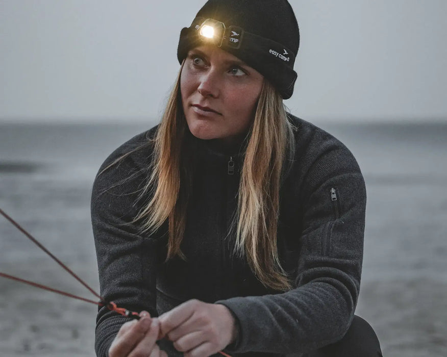 Easy Camp Clover Camping Head Torch - lifestyle image, showing person wearing head torch