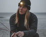 Easy Camp Clover Camping Head Torch - lifestyle image, showing person wearing head torch