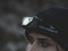 Easy Camp Crowberry Rechargeable Head Torch - lifestyle image, showing close-up of person wearing lit head torch