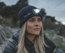 Easy Camp Crowberry Rechargeable Head Torch - lifestyle image, showing person wearing lit head torch
