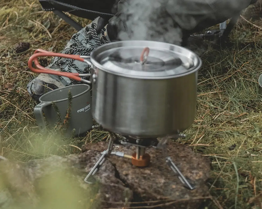 Easy Camp Moss 4 Person Camping Cook Set - product image, showing close-up of pot on top of lit camping stove