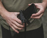 Easy Camp Sandwort Waterproof Smartphone Case - lifestyle image, showing phone being inserted into case