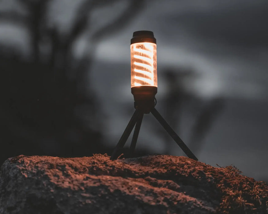 Easy Camp Wintergreen Lantern - lifestyle image, showing lantern on tripod stand outdoors