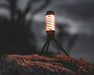 Easy Camp Wintergreen Lantern - lifestyle image, showing lantern on tripod stand outdoors