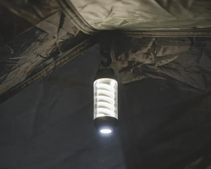 Easy Camp Wintergreen Lantern - lifestyle image, showing lantern hanging by hook inside tent