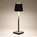 Leisurewize Lucia Rechargeable Table Lamp – Black - product image, showing lamp illuminated against beige background