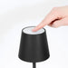 Leisurewize Lucia Rechargeable Table Lamp – Black - product image, showing lamp head with person's hand demonstrating how to turn lamp on and off