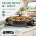 Leisurewize Multi-Functional Electric Skillet / Cooker 1500W - product infographic, showing a skillet containing chicken and vegetables on a worktop inside of a caravan or motorhome, with graphic in lower-left corner showing 38cm diameter and 4cm depth