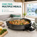Leisurewize Multi-Functional Electric Skillet / Cooker 1500W - product infographic showing a black electric multi-cooker skillet with a glass lid sitting on a kitchen counter, filled with cooked chicken, broccoli, and peppers. The scene is styled as a camper kitchen with a window showing a lake view, and text on the left reads 'ONE PAN. MULTIPLE MEALS.'