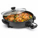 Leisurewize Multi-Functional Electric Skillet / Cooker 1500W - main product image, showing a round electric skillet with a textured black non-stick coating, a clear glass lid, and a side dial, filled with cooked chicken and vegetables on a white background.