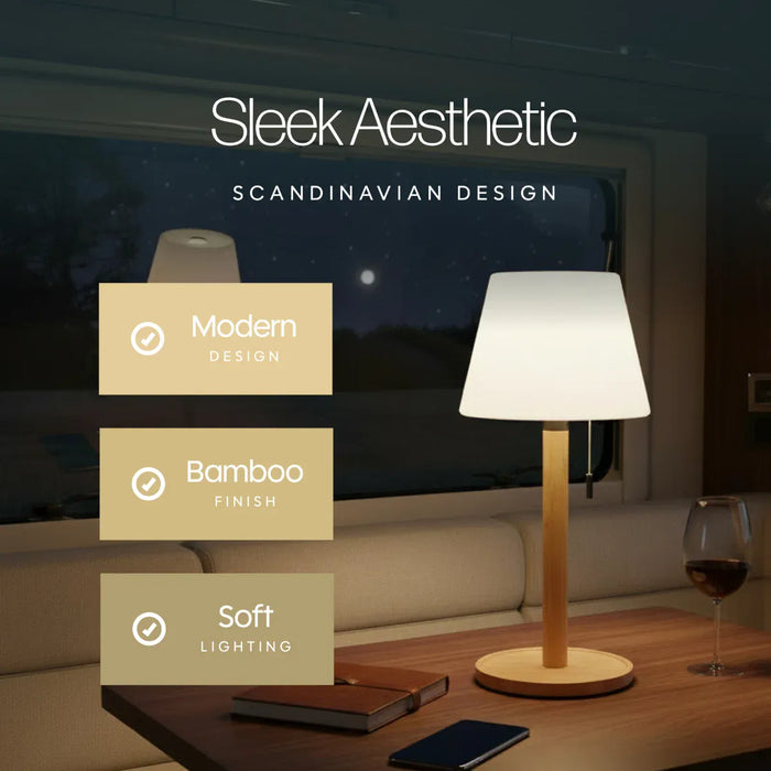 Leisurewize Orli Rechargeable Table Lamp – product image, showing a modern table lamp with a white conical shade and a light bamboo wood base sitting on a wooden table in a dimly lit interior setting. Text overlays read 'Sleek Aesthetic', 'SCANDINAVIAN DESIGN', and feature callouts for 'Modern Design', 'Bamboo Finish', and 'Soft Lighting'.