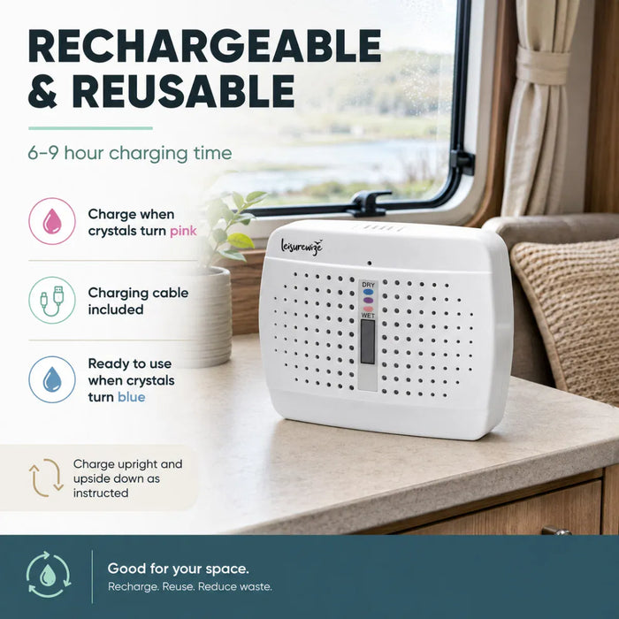 Leisurewize Rechargeable Portable Dehumidifier - product image, showing a dehumidifer on a countertop in a bathroom or vanity setting, with large marketing text on the left and a window and curtain in the background. The product has a small front display and ventilation holes, and the image emphasizes rechargeability and reusability.