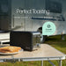 Leisurewize Sleek 2-Slice Toaster Black 850W - product image, showing a black toaster sitting on a folding camp table outdoors with toast on a plate in the foreground and an RV blurred in the background. Text reads 'Perfect Toasting' and 'FROM LIGHT TO GOLDEN BROWN,' with a badge saying '6 Level Controls.
