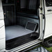 Maypole Single Steel Folding Caravan Step - product image, shown folded flat leaning inside vehicle