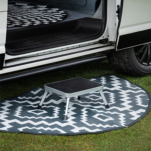 Maypole Single Steel Folding Caravan Step - product image, showing step at vehicle door entrance on carpet