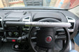 Milenco High Security Steering Wheel Lock - Silver - product image, showing interior view of vehicle with wheel lock affixed to steering wheel
