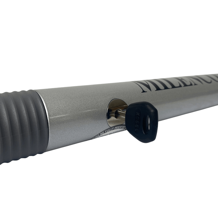 Milenco High Security Steering Wheel Lock - Silver - product image, showing close-up of key in vertical position inserted into wheel lock