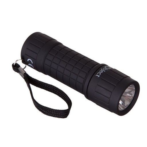 Object 0.5W COB LED Compact Torch - main product image, showing a black cylindrical flashlight with a textured grip, a black wrist strap, and a clear lens, shown on a plain white background. The brand name 'Object' is printed on the side.