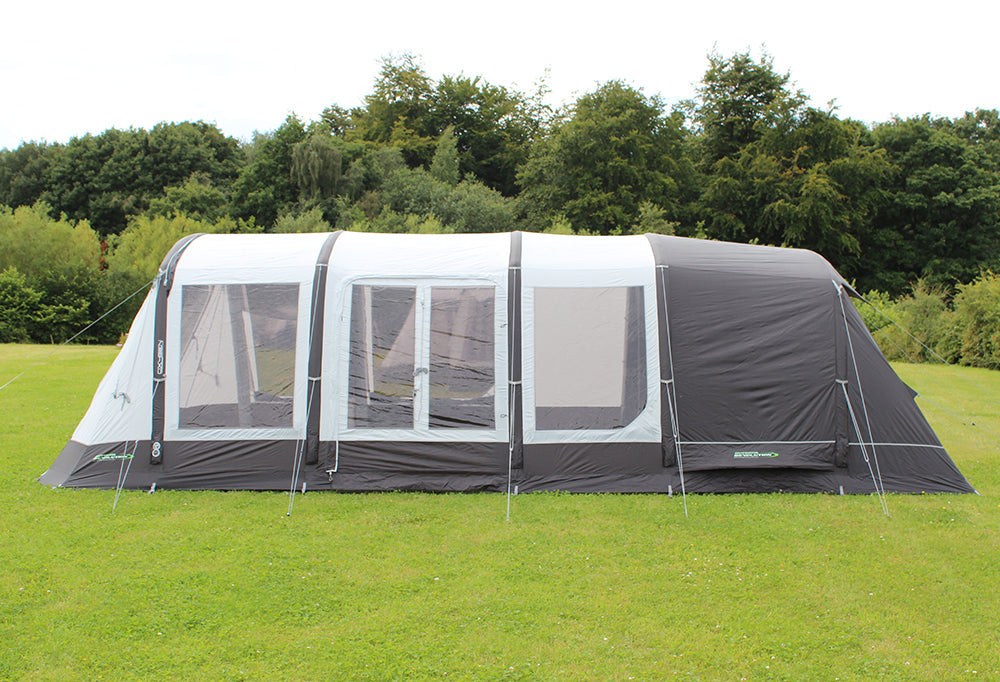 Outdoor Revolution Airedale 6S Inflatable Tent 2024 - 6 Berth Tunnel Tent feature image of tent pitched on campsite. side view of tent with all doors zipped up and curtains open