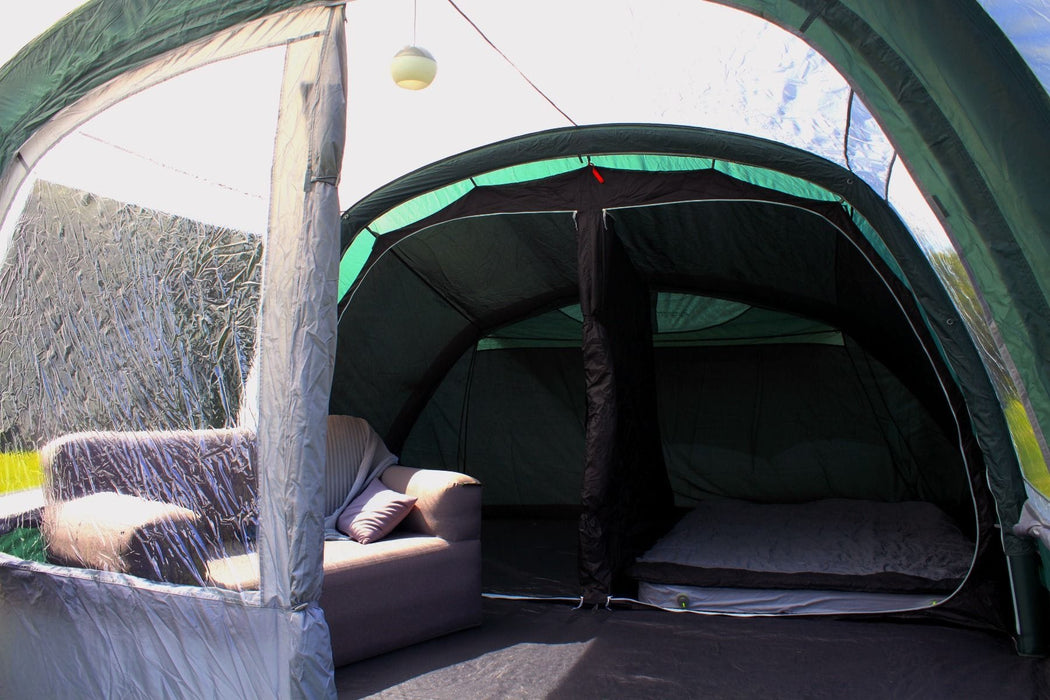 Outdoor Revolution Atom 500 - product image, showing tent interior with front door and inner bedroom doors open, and with campbed and sofa inside tent