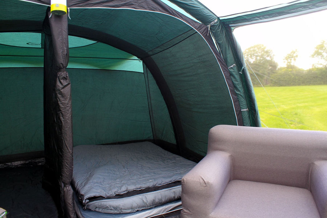 Outdoor Revolution Atom 600 - product image, showing internal view of tent with bedroom doors open, with chair, hanging light, and campbed all visible inside