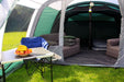 Outdoor Revolution Atom 600 - product image, showing internal view of tent with all doors open, with chairs, sofa, table, hanging lights, and campbed all visible inside