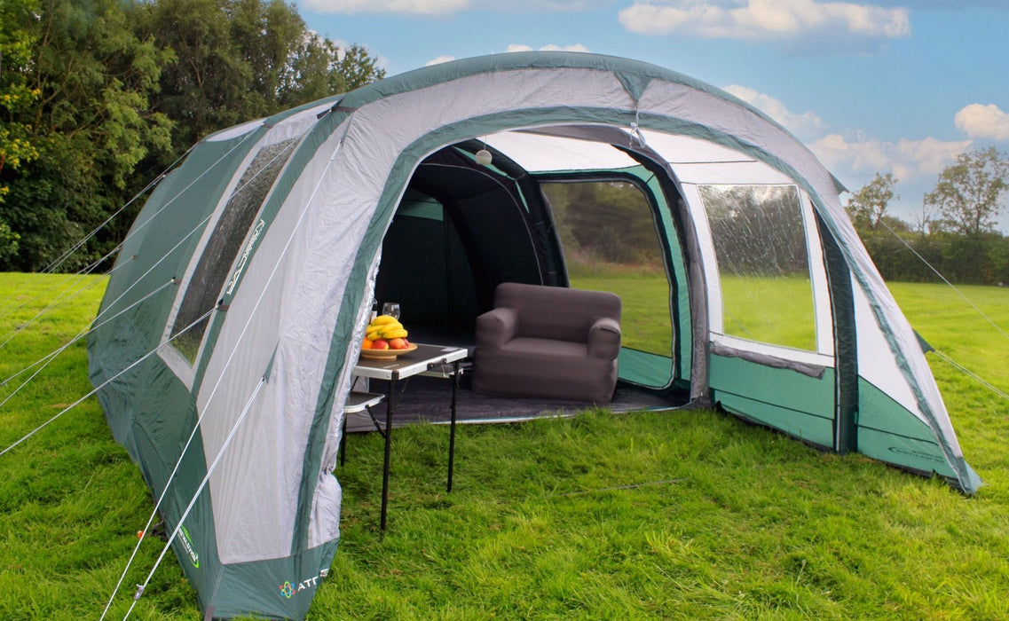 Outdoor Revolution Atom 600 - product image, shown pitched in field from front view, with all outer and inner doors open, showing furniture inside