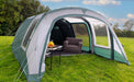 Outdoor Revolution Atom 600 - product image, shown pitched in field from front view, with all outer and inner doors open, showing furniture inside