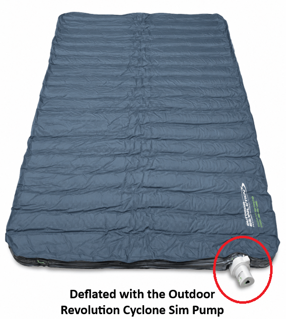 Blue inflatable mattress deflated for packing away with an Outdoor Revolution SIM pump that's connected on a white background