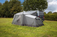 orda1623-03 Camping tent attached to a van in an outdoor setting with trees and grass.