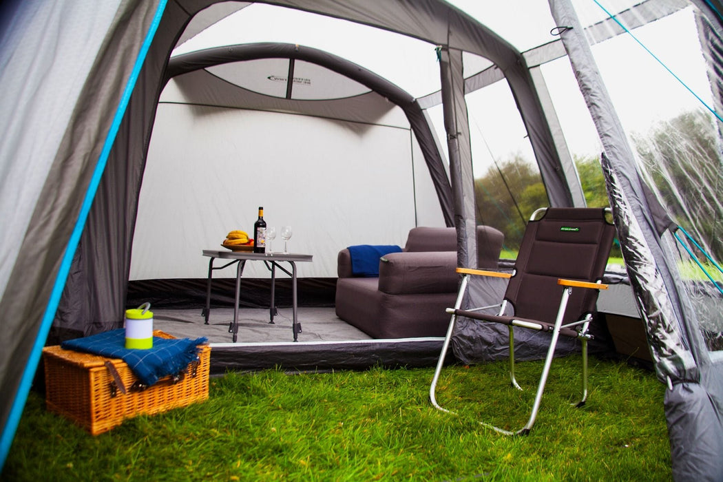 Camping tent interior with furniture and outdoor setup