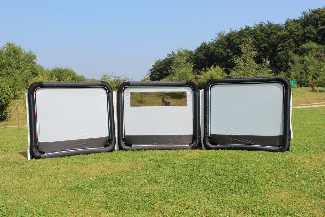 Outdoor Revolution Oxygen Pro 3 Panel Inflatable Windbreak 130 x 490cm feature image showing the three panels and the airtubes that surround each panel . pitched on campsite with tents in background. 