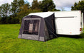 Outdoor Revolution Porch Pro 260 Inflatable Caravan Awning - main product image, showing awning pitched and attached to caravan in a field surrounded by trees