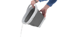 Outwell 9 Litre Collapsible Square Bucket - product image, showing person tipping water out of bucket