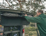 Outwell Backroads Campervan Awning Room - lifestyle image, showing annexe being stowed in vehicle roof space