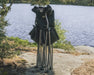 Outwell Catamarca Sofa - 2 Person Camping Chair - lifestyle image, showing chair fully collapsed outside by a lakeside