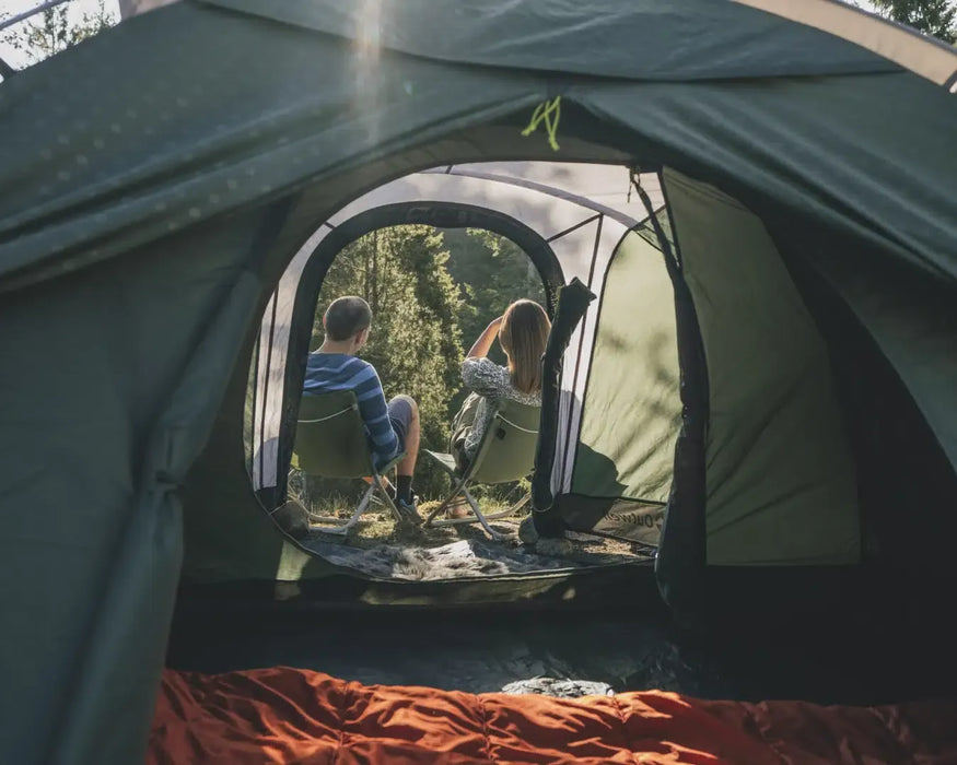 Outwell Cloud 5 Plus - Large Dome Family Tent - lifestyle image, showing couple through open tent doors