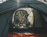 Outwell Cloud 5 Plus - Large Dome Family Tent - lifestyle image, showing couple through open tent doors