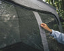 Outwell Dakota Freestanding Outdoor Camping Shelter - lifestyle image, showing person with shelter