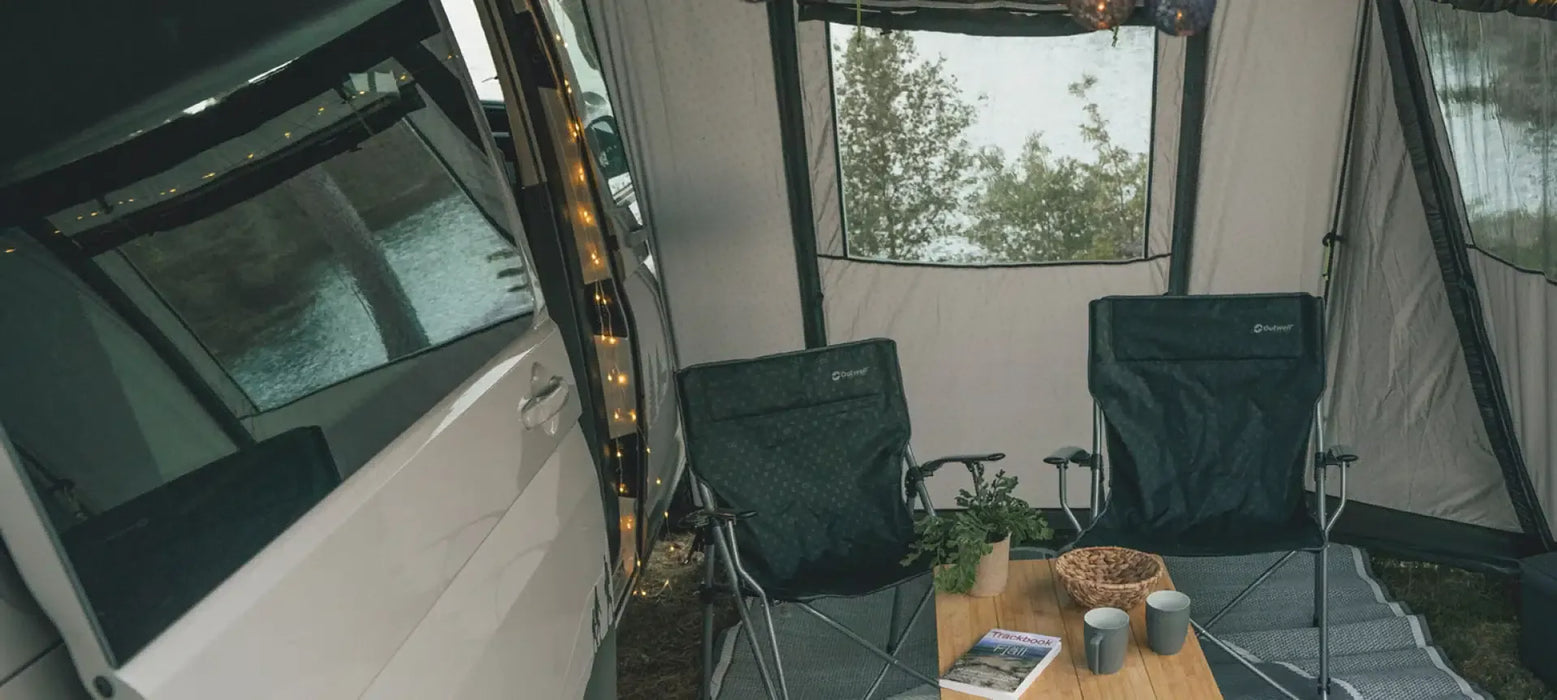 Outwell Moonstone String Light Camping Lantern - lifestyle image, showing string light inside vehicle door with awning and chairs