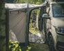 Outwell Pine Hills Drive Away Campervan Awning - lifestyle image, showing awning connected to vehicle with tunnel doors open