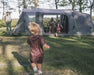 Outwell Sacramento 6 Air Inflatable 6 Person Tent - lifestyle image, showing parents and children with tent