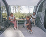 Outwell Sacramento 6 Air Inflatable 6 Person Tent - lifestyle image, showing parents and child inside tent