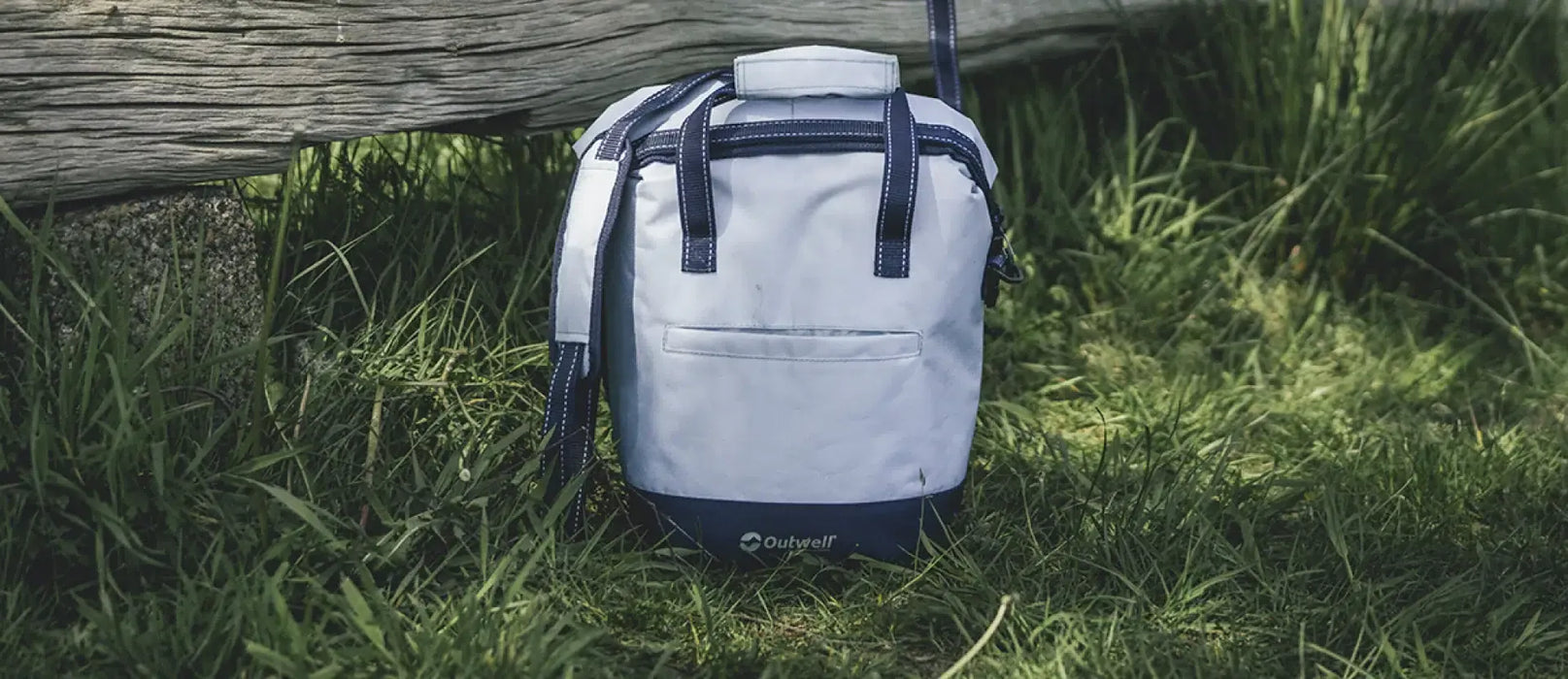 Outwell Sanderling 20 Litre Camping Cool Bag - lifestyle image, showing cool bag outdoors
