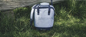 Outwell Sanderling 20 Litre Camping Cool Bag - lifestyle image, showing cool bag outdoors
